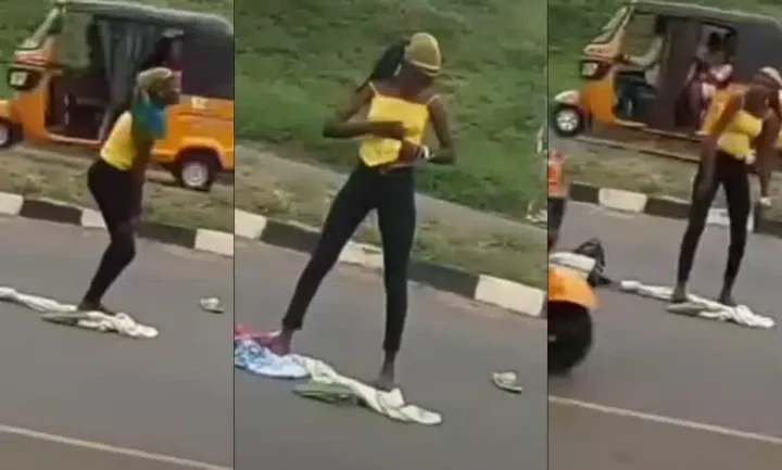 Lady runs mad after being dropped by an alleged yahoo boy in middle of a road (Video)